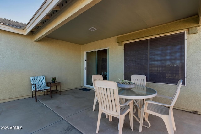 view of patio featuring visible vents and outdoor dining space