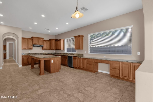 kitchen with sink, a kitchen island, pendant lighting, and black dishwasher