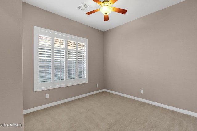 carpeted empty room with ceiling fan