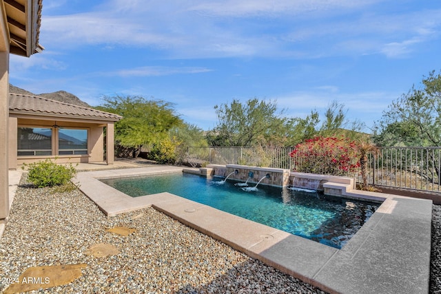 view of pool featuring pool water feature and ceiling fan