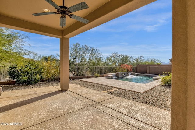 view of patio / terrace with pool water feature, ceiling fan, and a fenced in pool