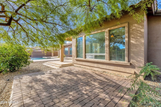 view of patio with a fenced in pool