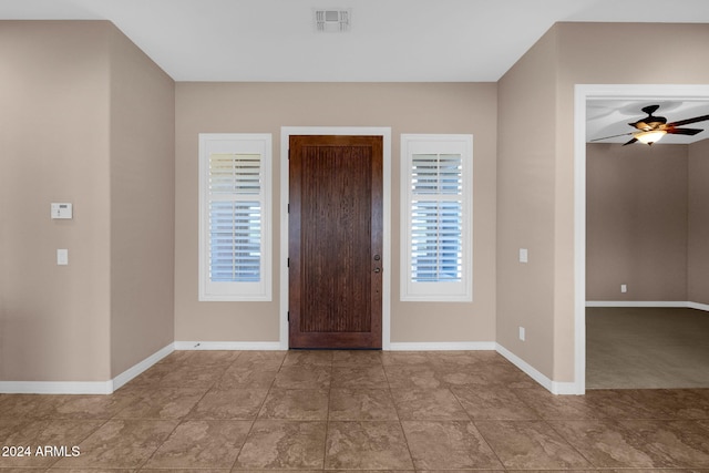 entryway with ceiling fan and a healthy amount of sunlight