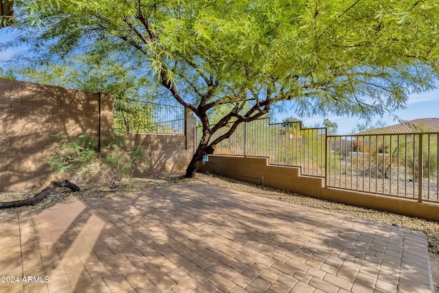 wooden deck with a patio