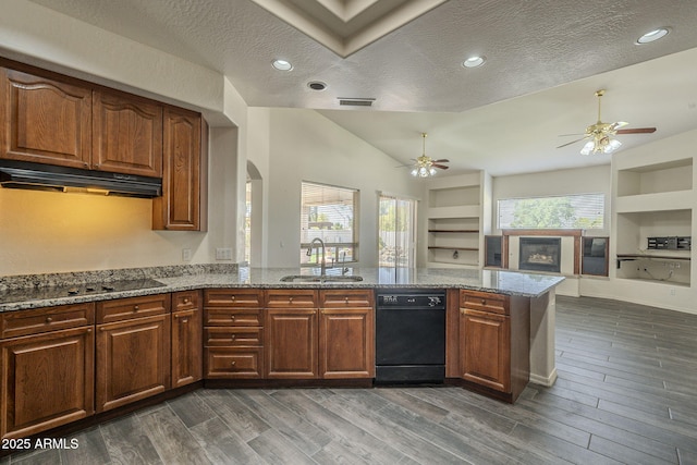 kitchen with visible vents, a ceiling fan, under cabinet range hood, a sink, and black appliances