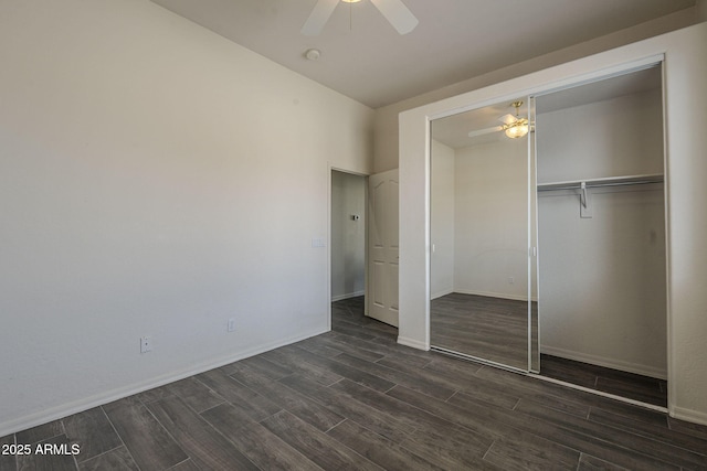 unfurnished bedroom featuring wood tiled floor, a closet, ceiling fan, and baseboards
