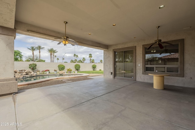 view of patio with a fenced in pool, a fenced backyard, and a ceiling fan