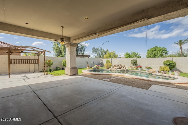 view of patio / terrace with a fenced backyard, a fenced in pool, and ceiling fan