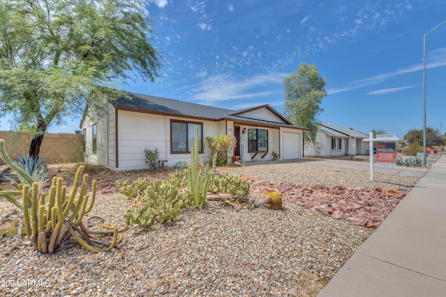 ranch-style home featuring a garage