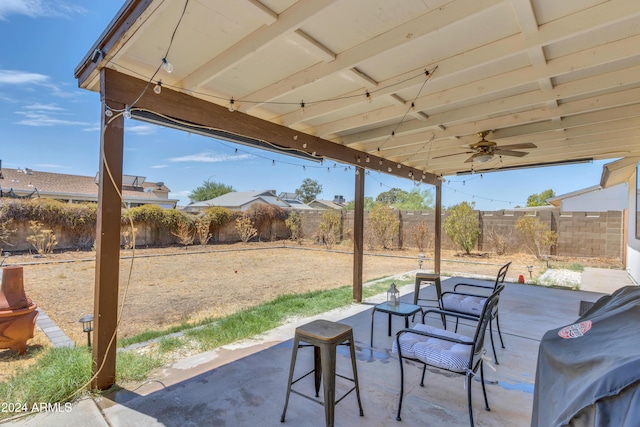 view of patio / terrace with area for grilling and ceiling fan