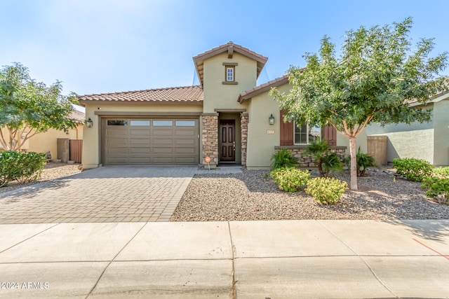 mediterranean / spanish-style house featuring a garage