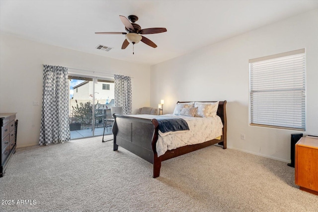 bedroom featuring ceiling fan, access to exterior, and light colored carpet