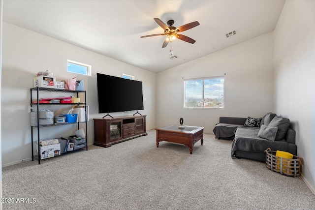 living room featuring ceiling fan, carpet flooring, and lofted ceiling