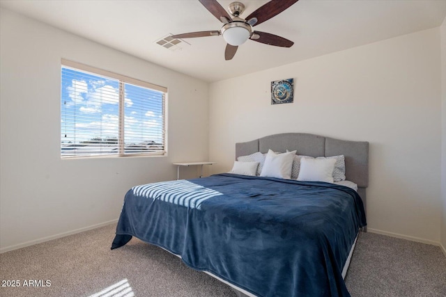 bedroom featuring ceiling fan and carpet