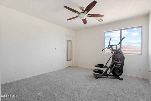 workout area with ceiling fan and carpet flooring