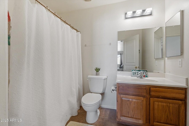 bathroom featuring toilet, tile patterned floors, and vanity