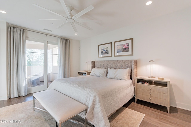 bedroom with ceiling fan and light wood-type flooring