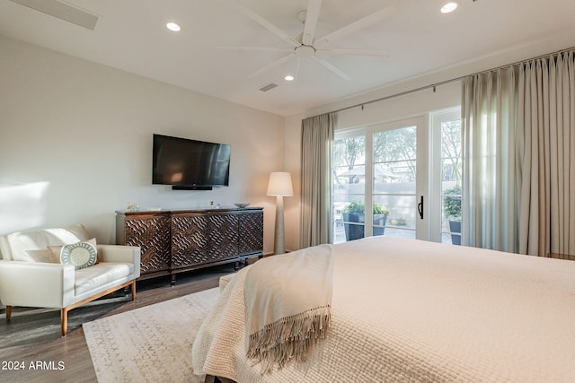 bedroom with hardwood / wood-style floors, access to outside, and ceiling fan