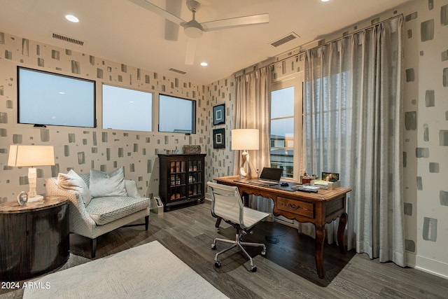 home office featuring ceiling fan and dark wood-type flooring