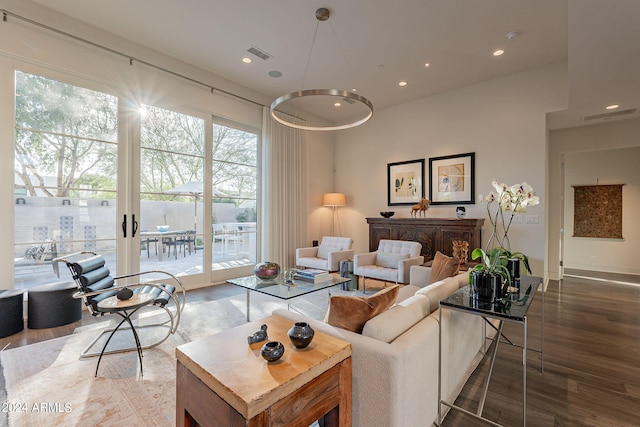 living room with french doors and wood-type flooring