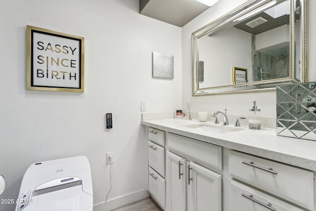 bathroom featuring hardwood / wood-style flooring and vanity