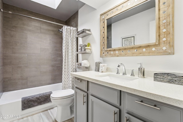 full bathroom with toilet, shower / tub combo with curtain, and vanity