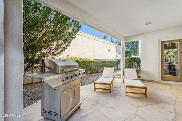 view of patio with a grill