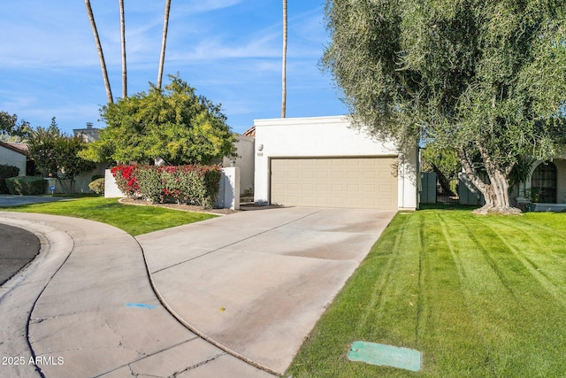 view of front facade with a front yard and a garage