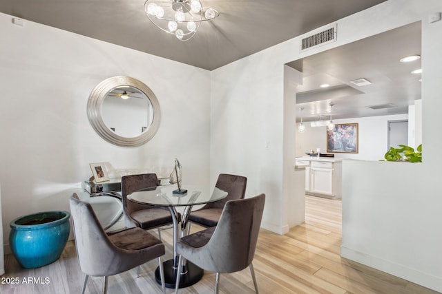 dining space featuring light hardwood / wood-style floors and ceiling fan