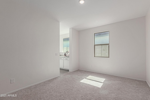 47469 W Cansados Rd, Maricopa, AZ 85139 - unfurnished room featuring light colored carpet and a sink