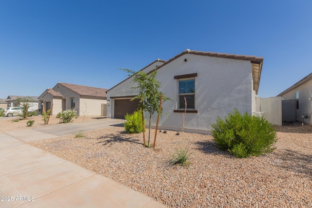 47469 W Cansados Rd, Maricopa, AZ 85139 - mediterranean / spanish-style house with stucco siding, concrete driveway, a garage, and a tiled roof