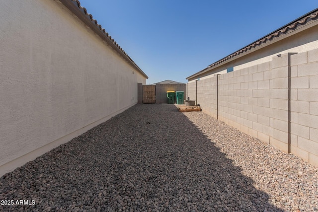 47469 W Cansados Rd, Maricopa, AZ 85139 - fenced backyard with a gate