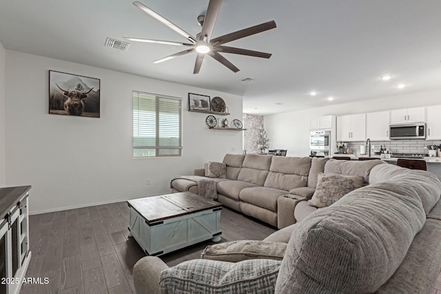 47469 W Cansados Rd, Maricopa, AZ 85139 - living room with ceiling fan, dark wood-type flooring, and recessed lighting