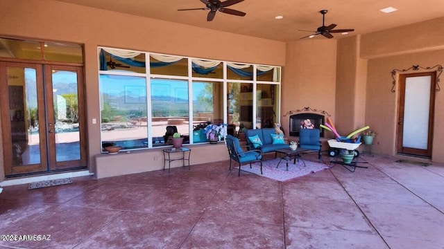 view of patio / terrace with an outdoor living space and a ceiling fan
