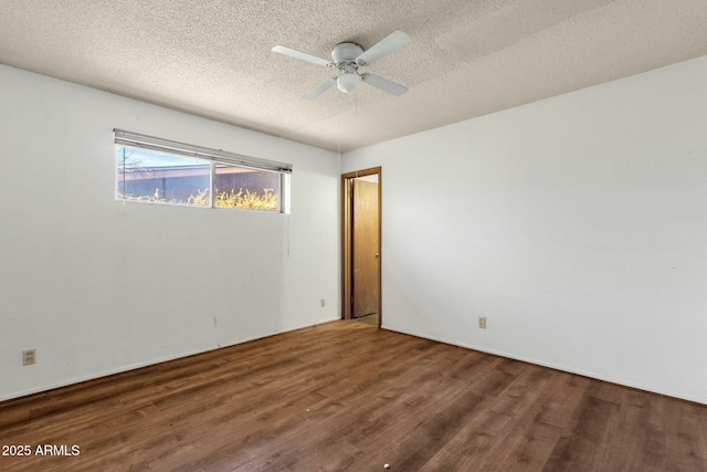 spare room featuring ceiling fan, a textured ceiling, and wood finished floors