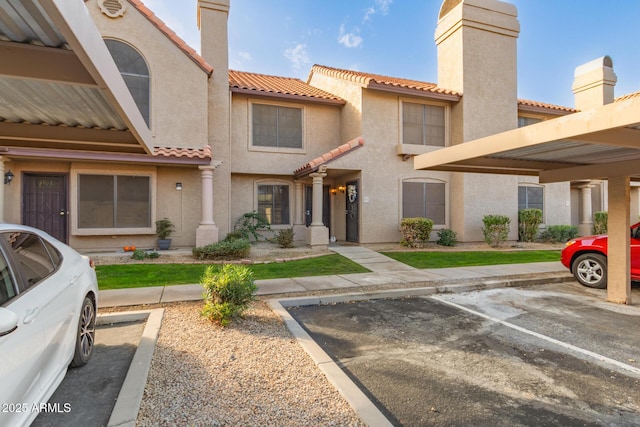 view of front of property with a carport