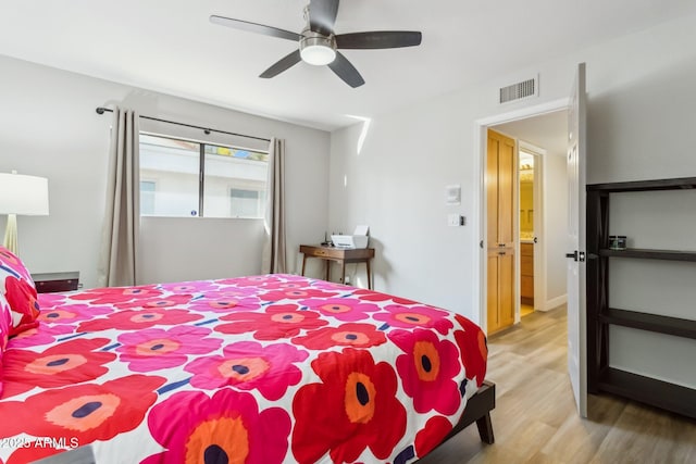 bedroom with ceiling fan and wood-type flooring