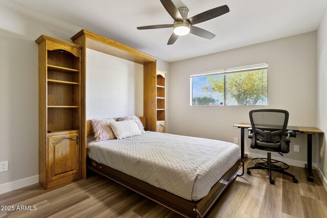 bedroom featuring light wood-type flooring and ceiling fan