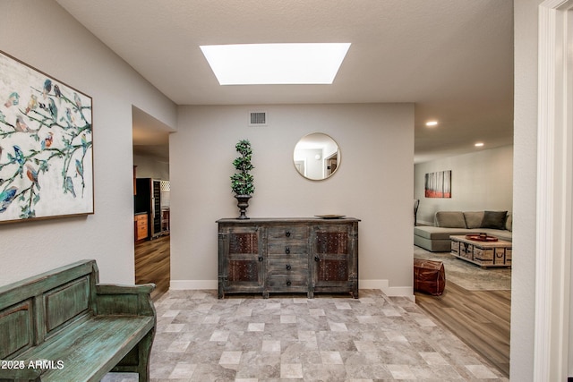 interior space featuring a skylight