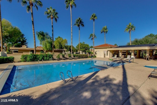 view of swimming pool featuring a patio area