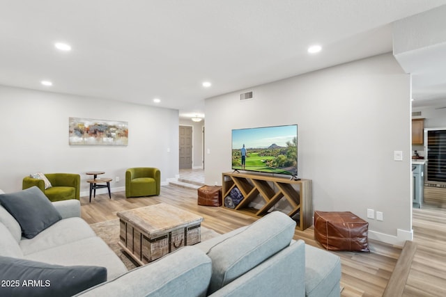 living room with light hardwood / wood-style flooring