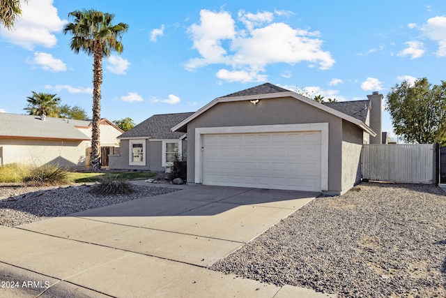 ranch-style home featuring a garage