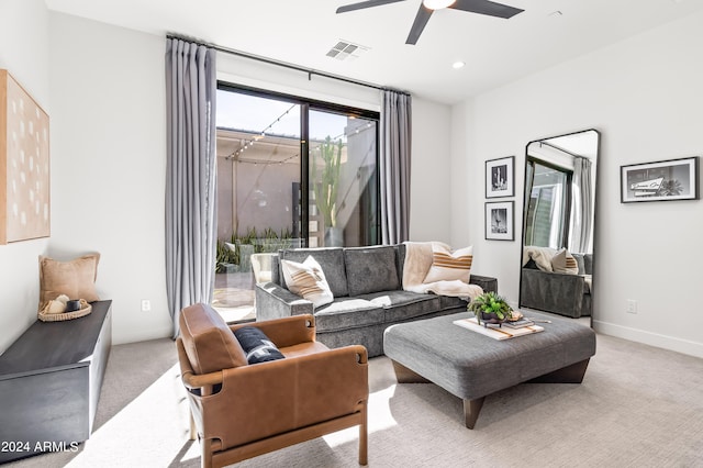 living room with light carpet and ceiling fan