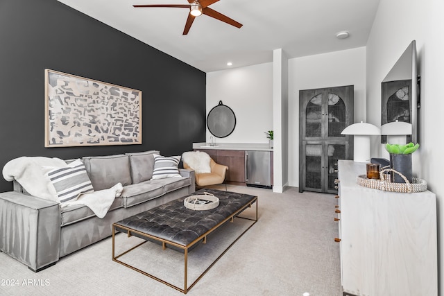 living room featuring light colored carpet and ceiling fan