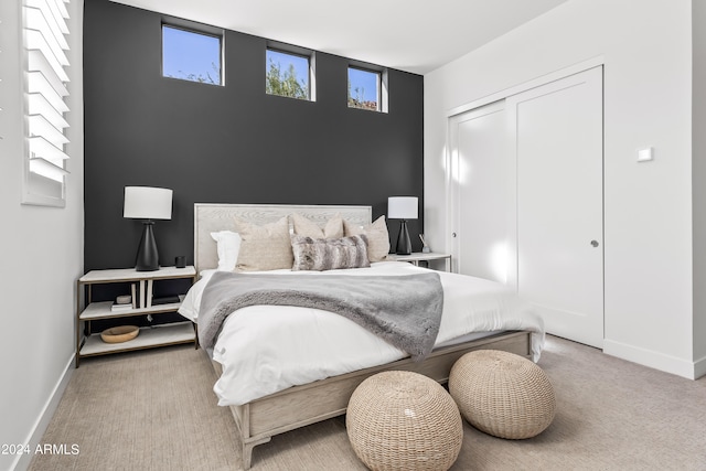 bedroom with carpet and a closet