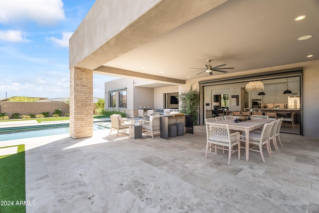 view of patio / terrace with a fenced in pool, an outdoor living space, and ceiling fan