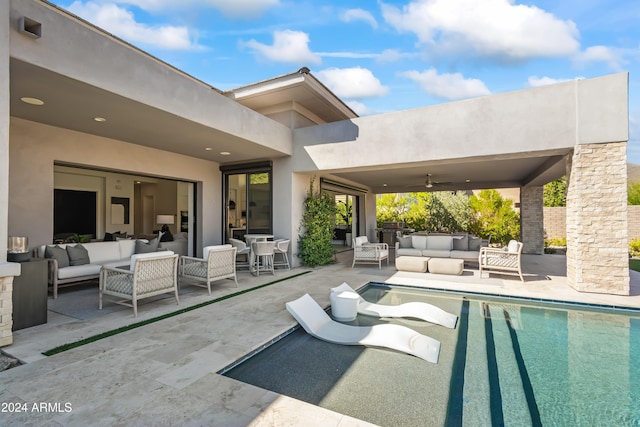 view of swimming pool with a patio, ceiling fan, and an outdoor hangout area