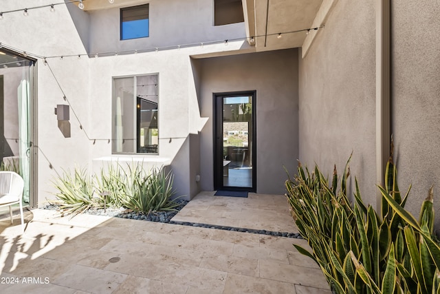 property entrance featuring a patio