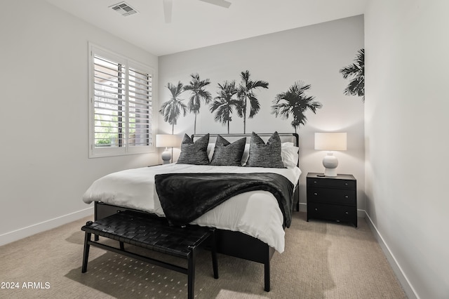 bedroom with ceiling fan and carpet floors