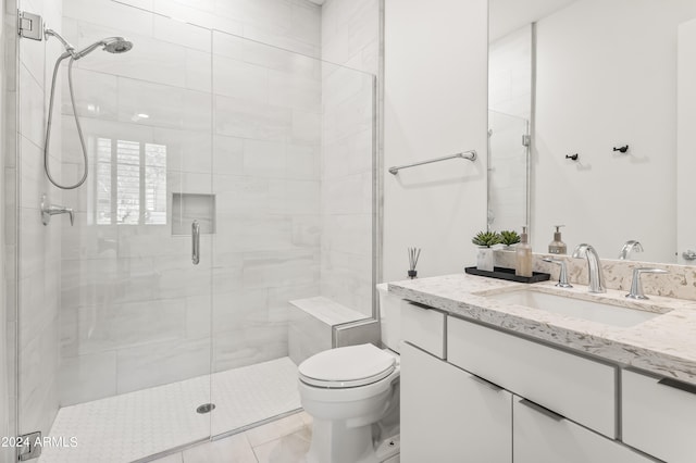 bathroom with vanity, toilet, and walk in shower